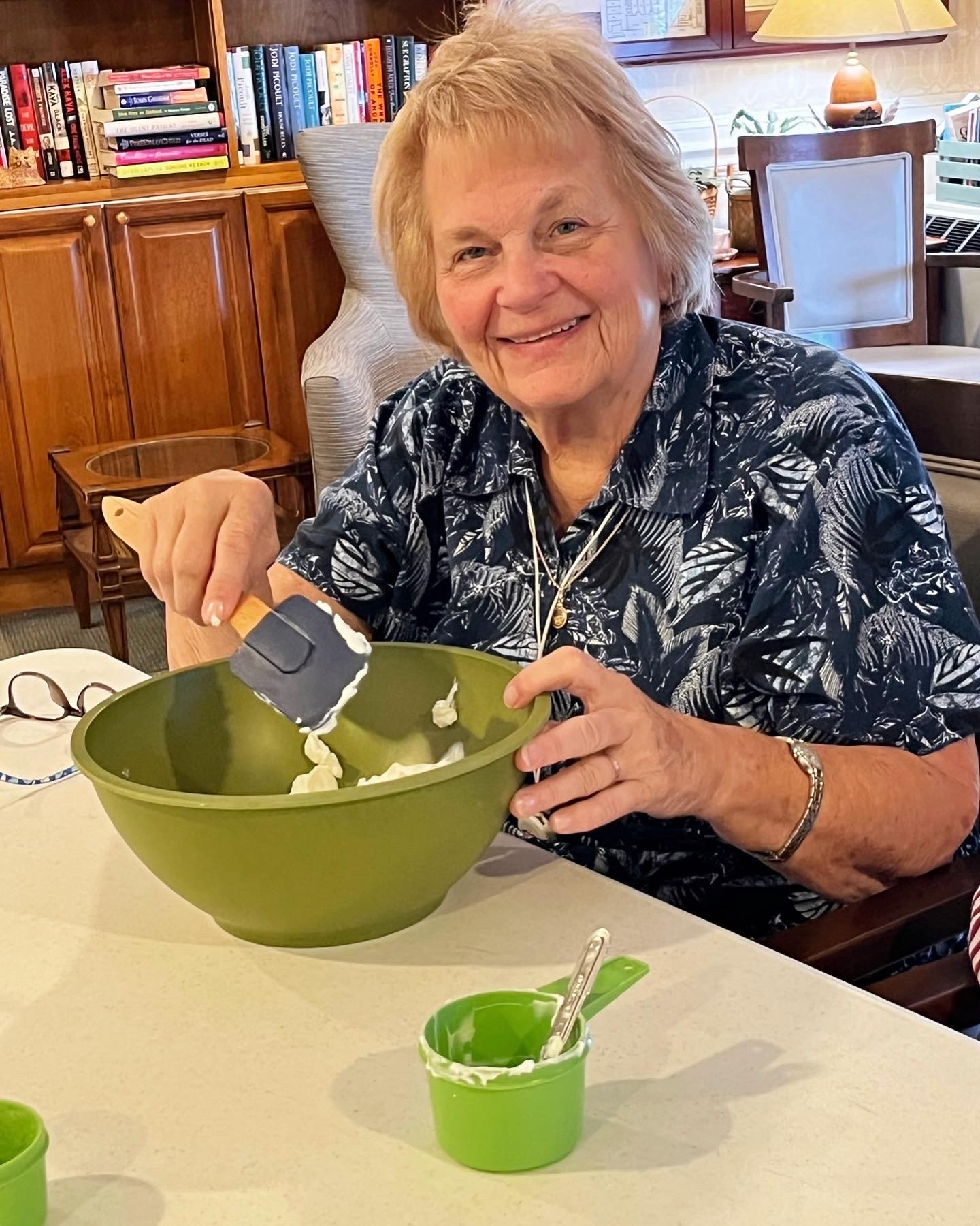 Resident enjoying an activity in the facility's common area