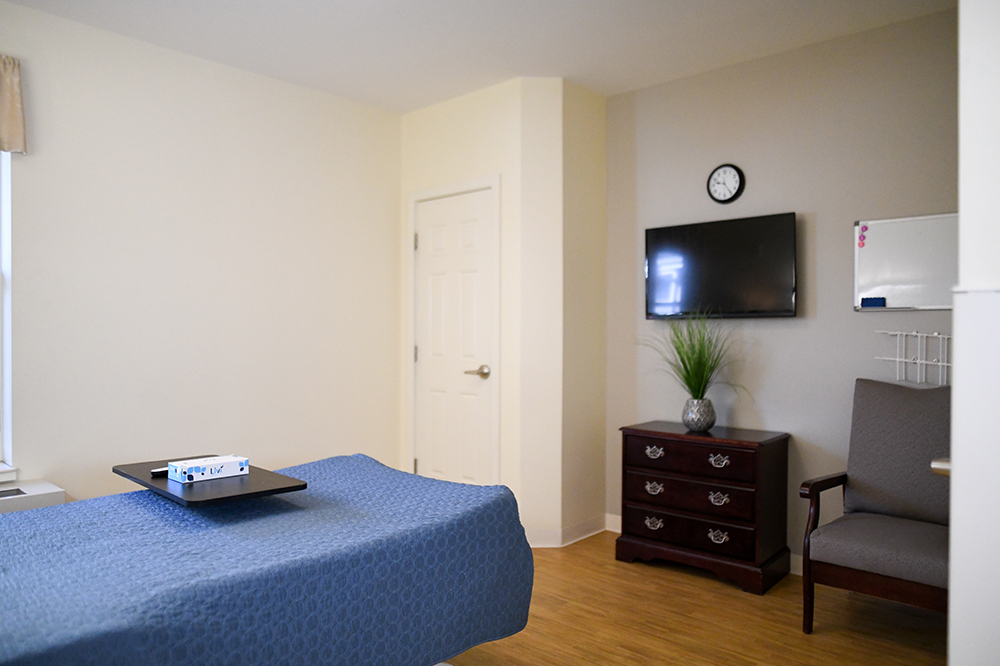 Private resident room with a bed and furniture