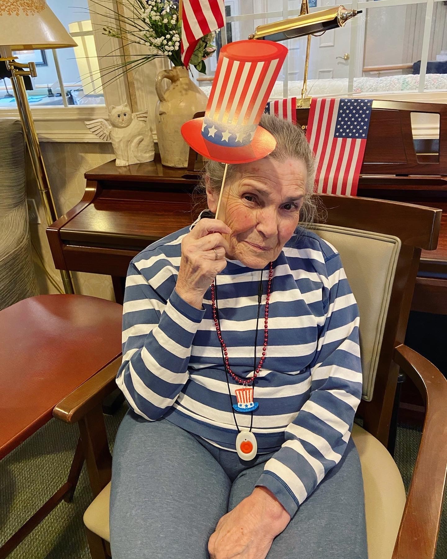 Resident celebrating with festive attire indoors