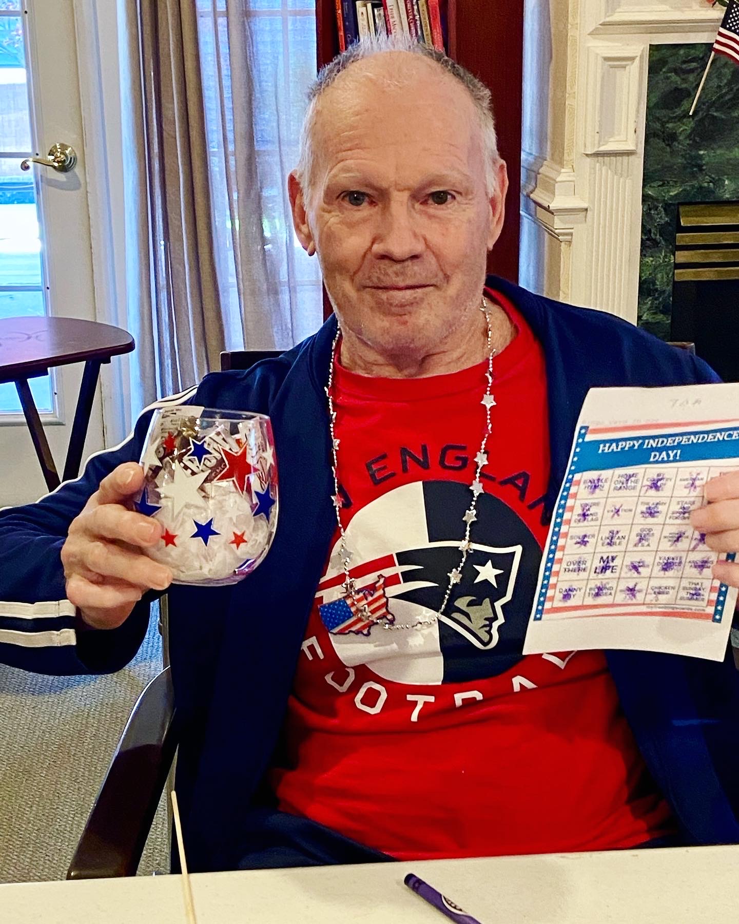 Resident celebrating Independence Day with crafts