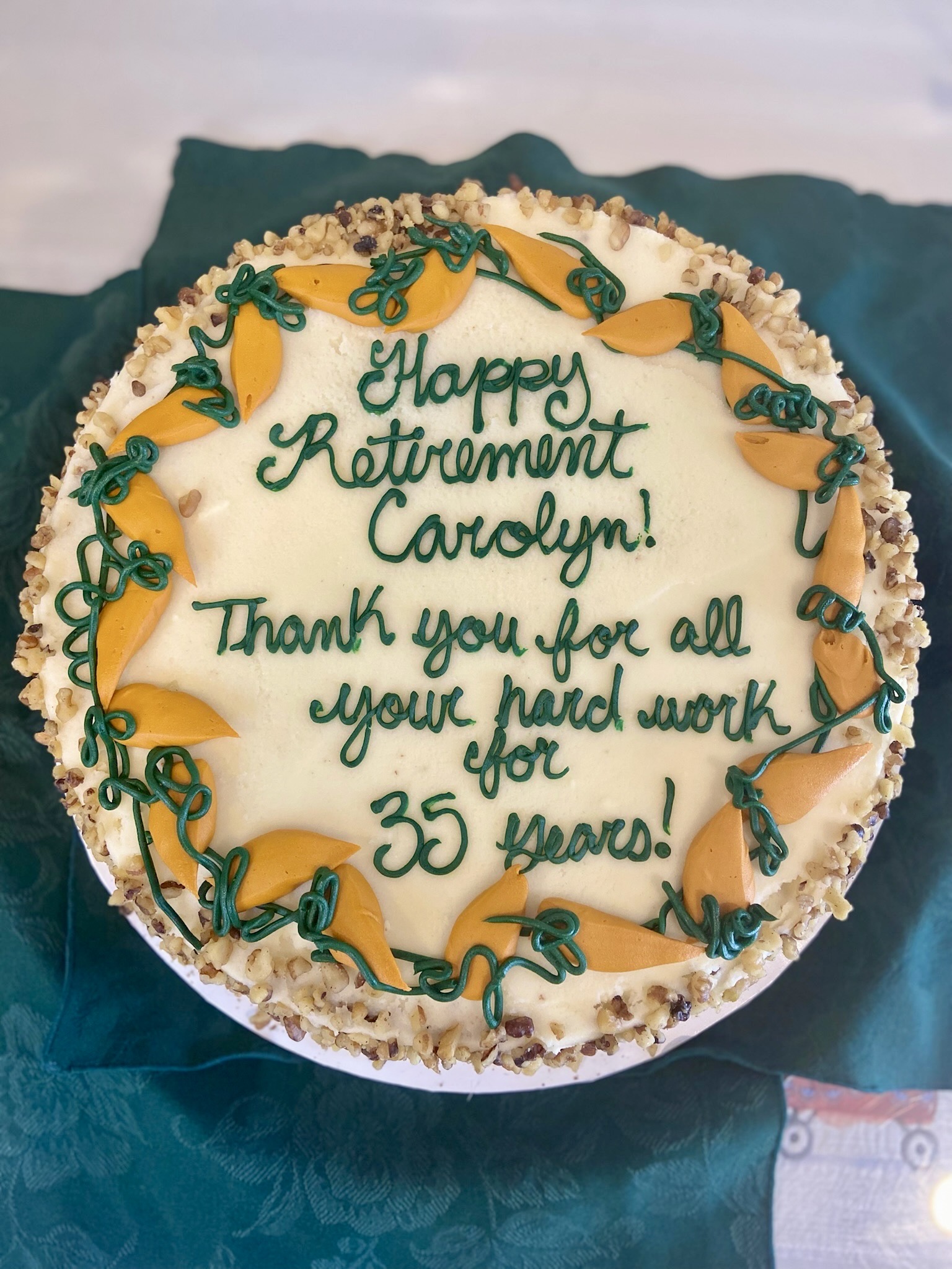 A beautifully decorated retirement cake with a message
