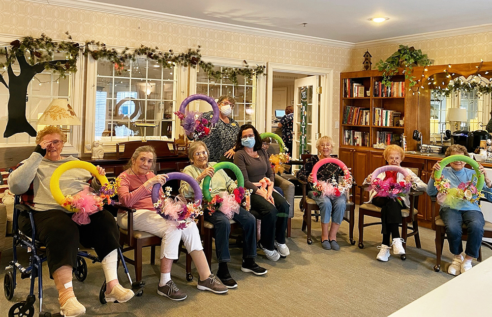 Residents engaging in a crafting activity in the common area
