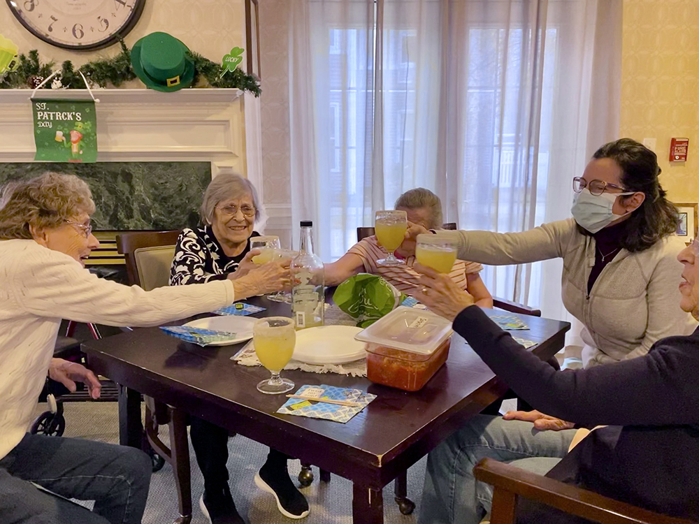 Residents enjoying a toast during a social gathering