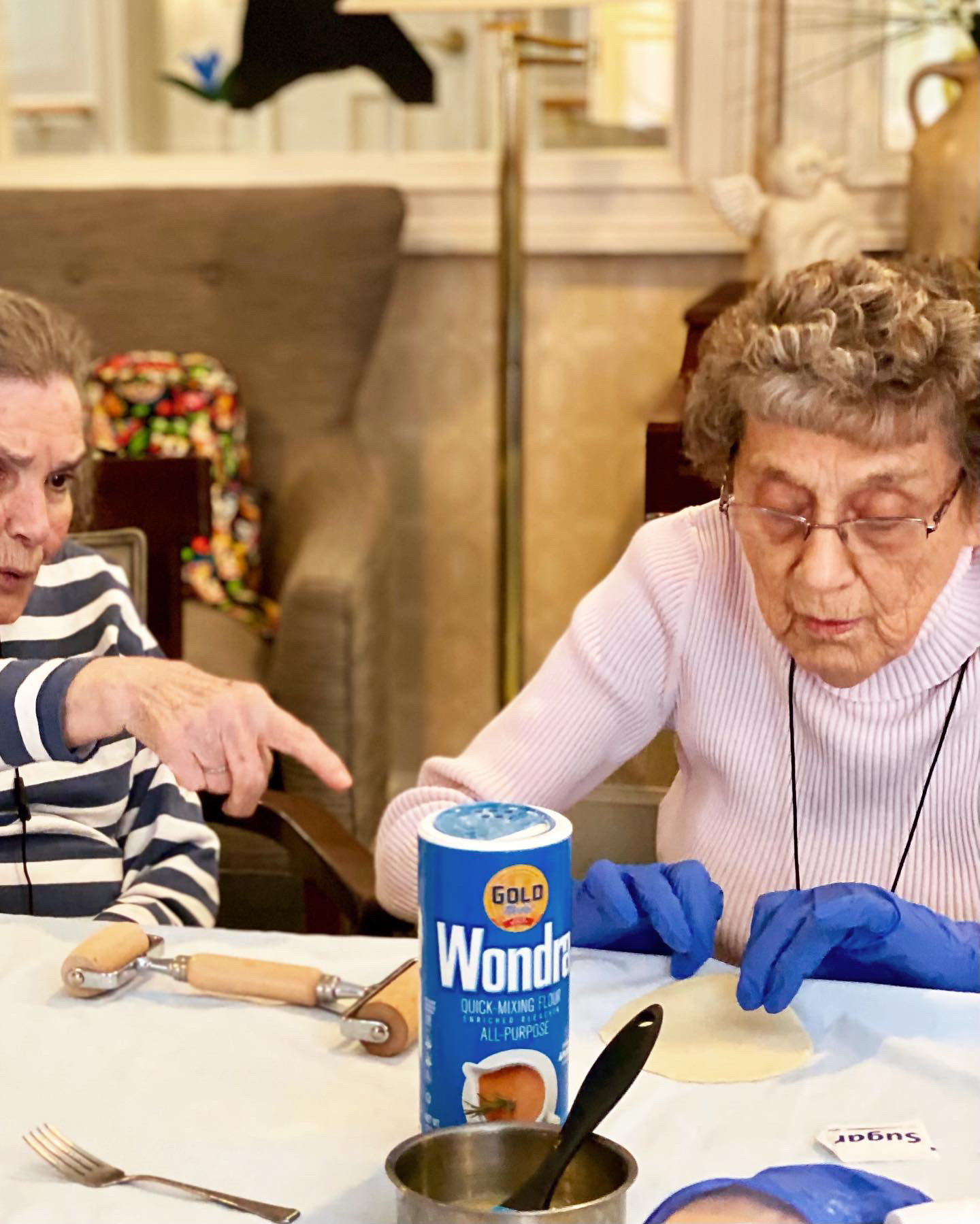 Two residents engaged in a baking activity