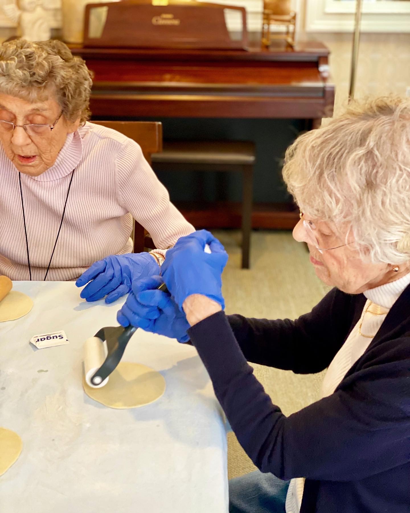 Residents participating in a craft activity at a table
