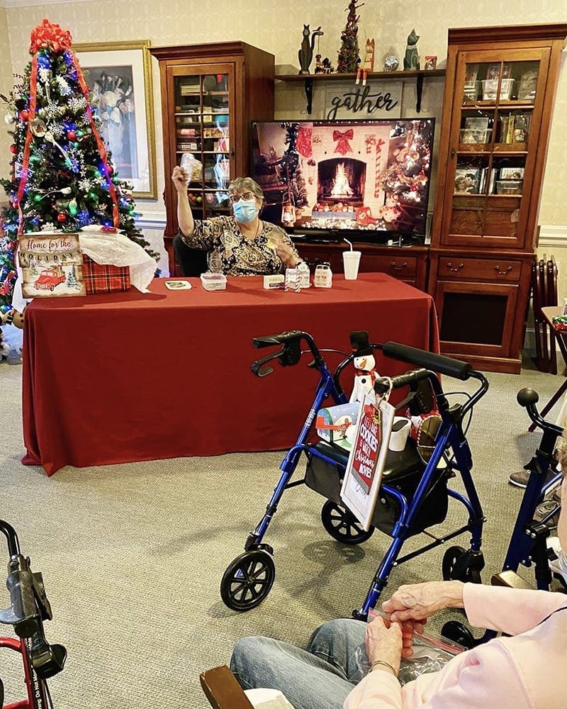 Residents participating in an activity in a cozy common area