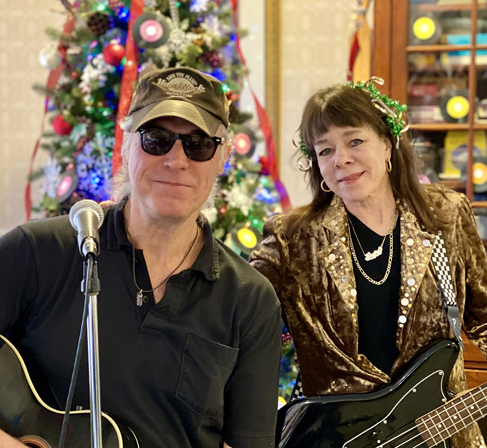 Musicians performing at a holiday event in a senior living community