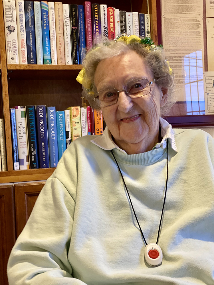 Senior resident smiling in a cozy common room