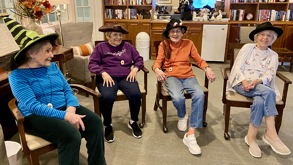 Residents enjoying a festive gathering in hats