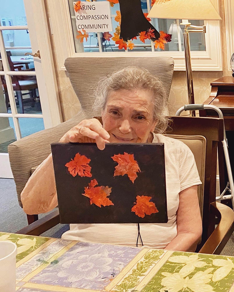 Resident creating art in a common area