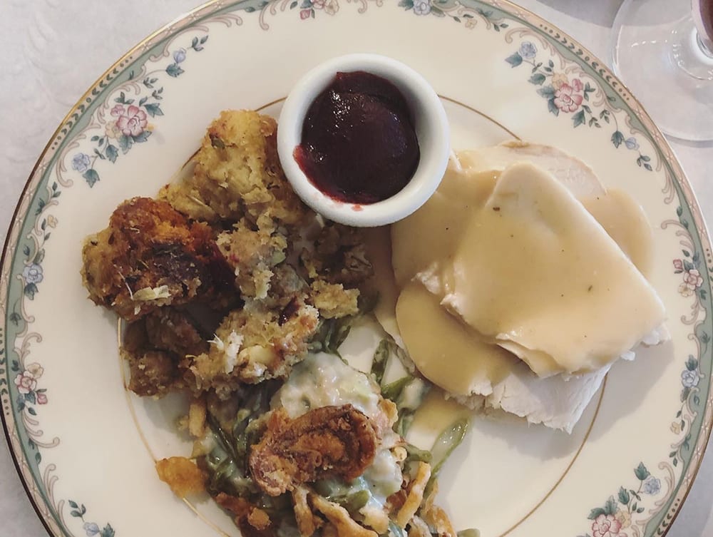 A plated meal featuring turkey and stuffing