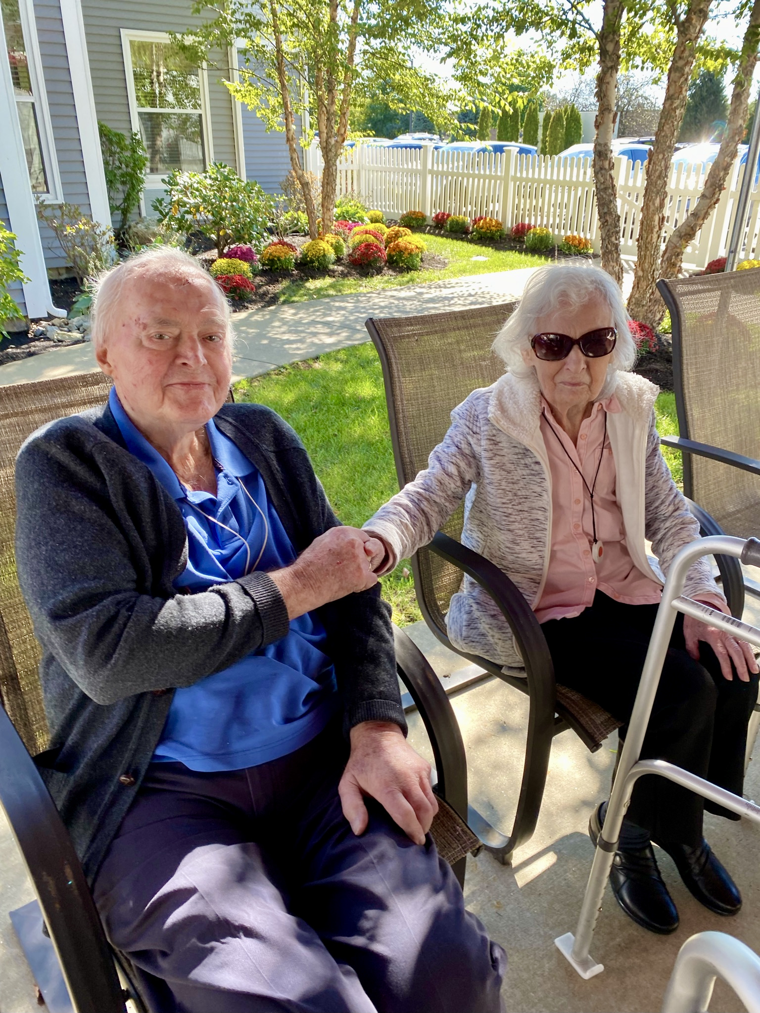 Residents enjoying time together outside in a garden