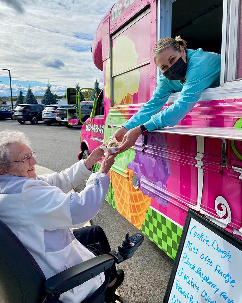 Resident enjoying ice cream from a food truck