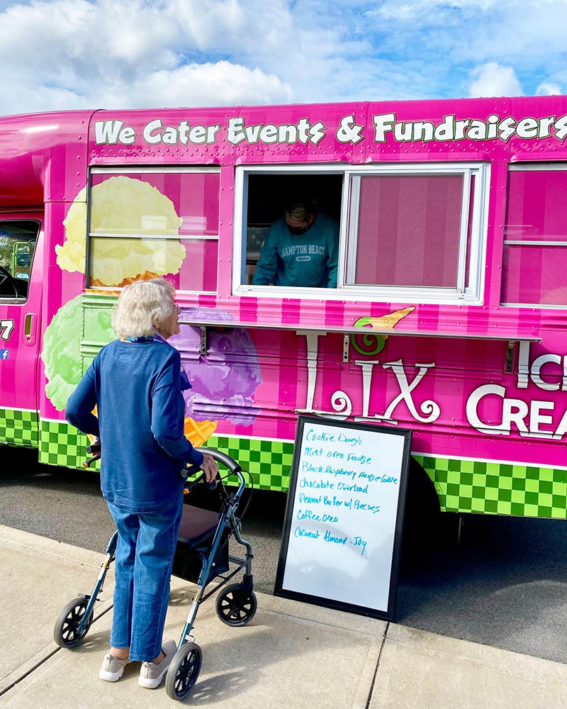 A resident enjoying an ice cream food truck event