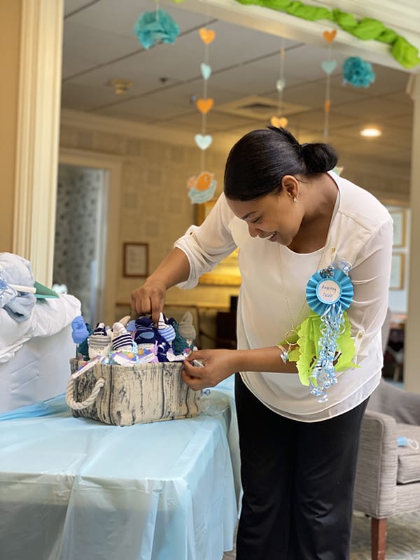Staff member arranging items in an activity room