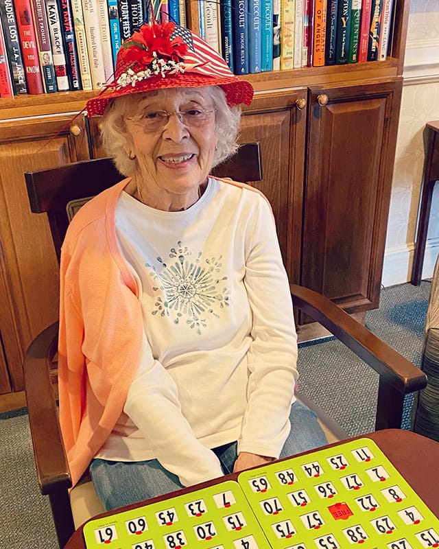 Resident playing bingo in a common area