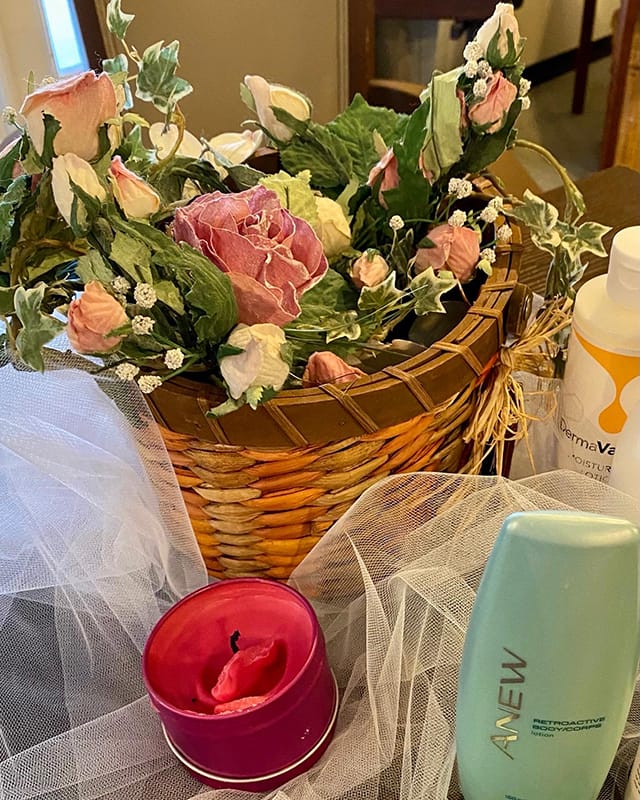 Basket of flowers and personal care products on a table