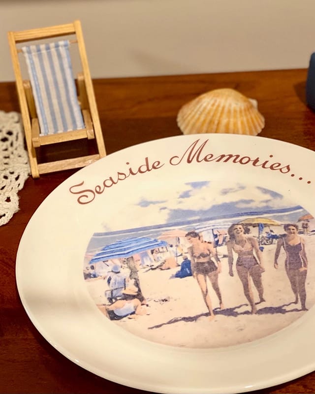 Decorative plate with beach scene and text