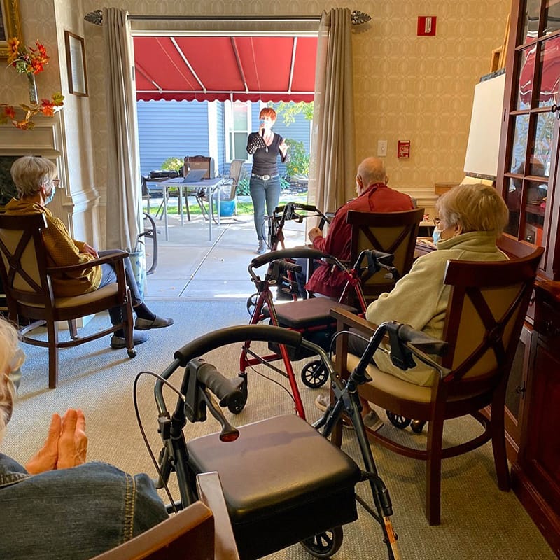 Residents engaging in a group activity inside the facility