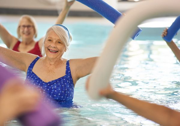 Residents participating in a water exercise class