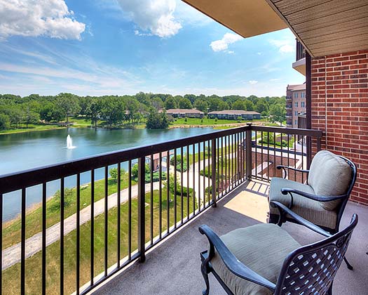 Balcony view overlooking the lake and gardens