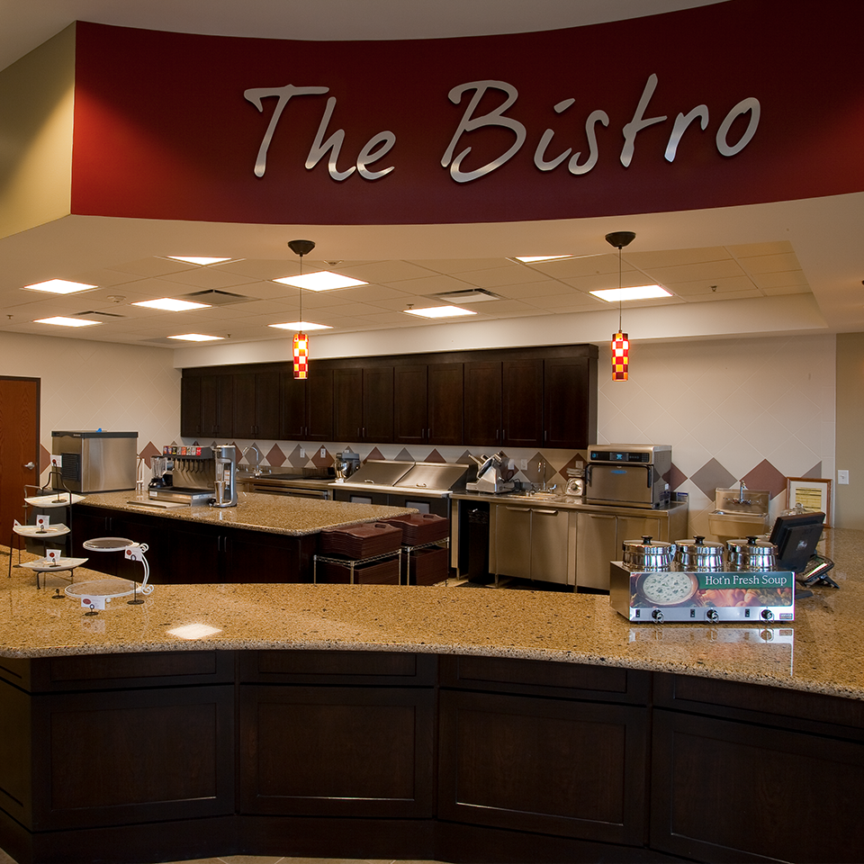 The Bistro dining area with a modern kitchen setup