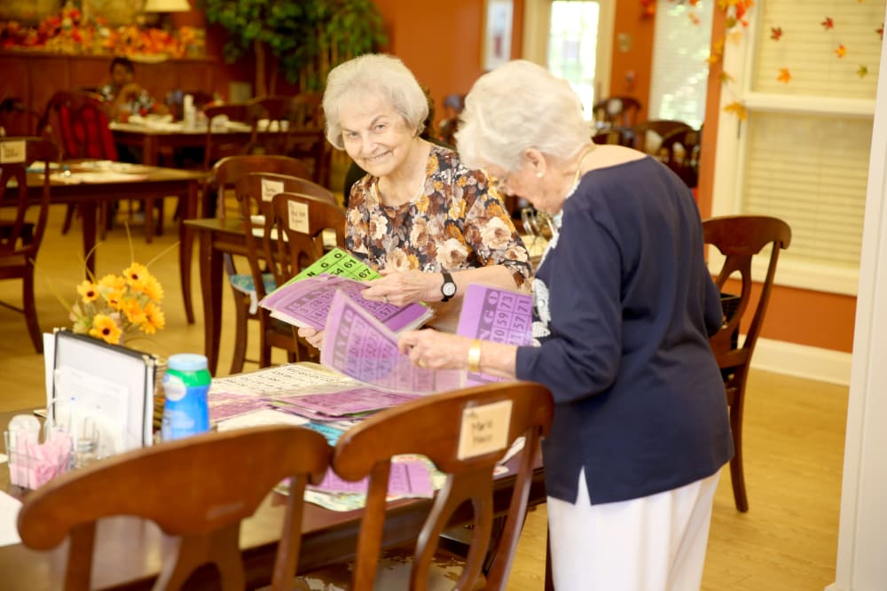 Residents engaged in a bingo activity in a common area