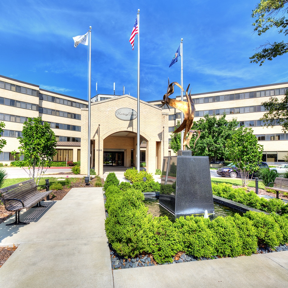 Exterior view of Lakeview Village with flags and sculpture