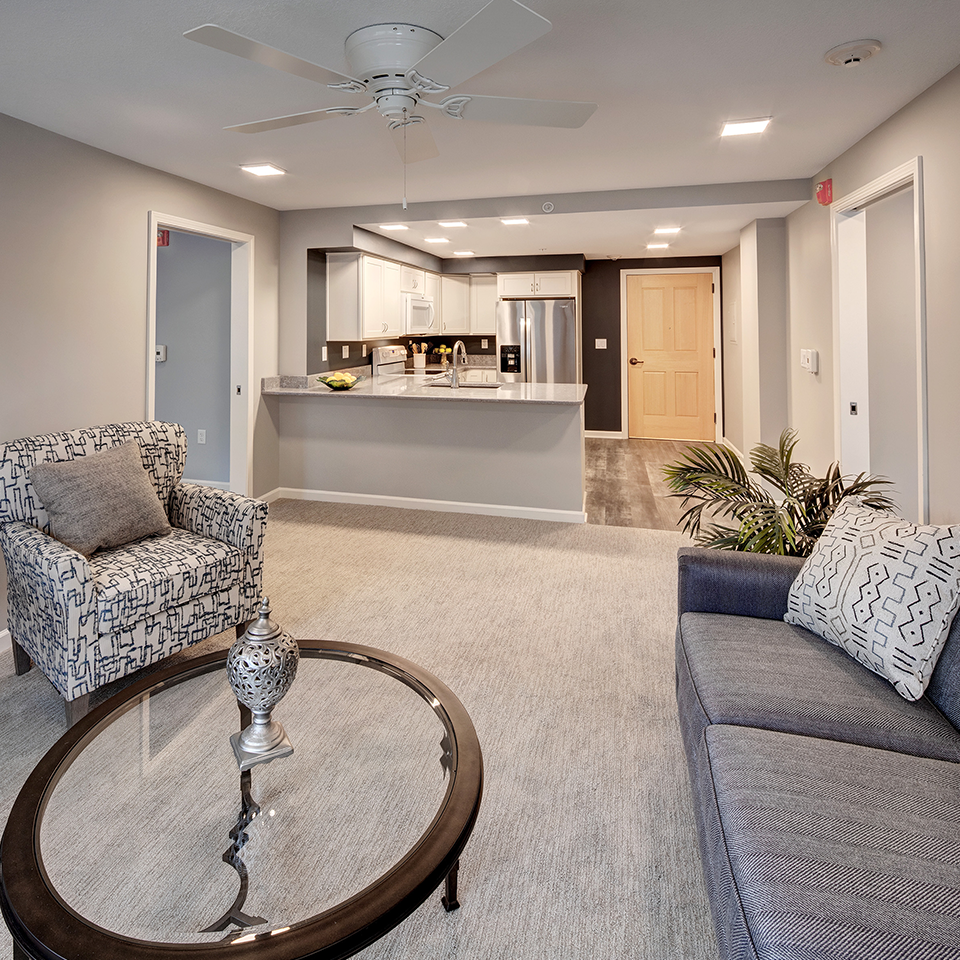Modern resident living space with furniture and kitchen