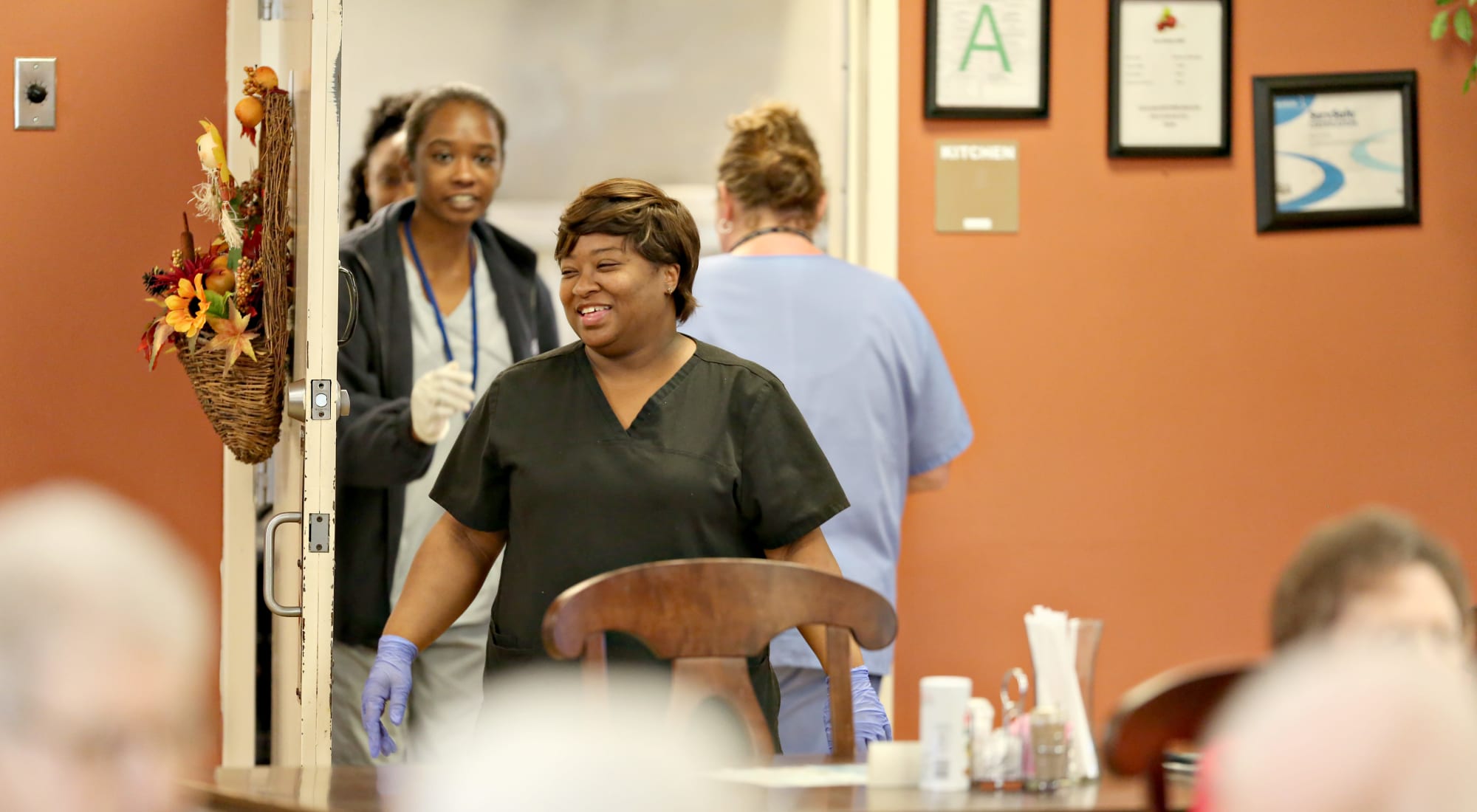 Staff members interacting in a common area