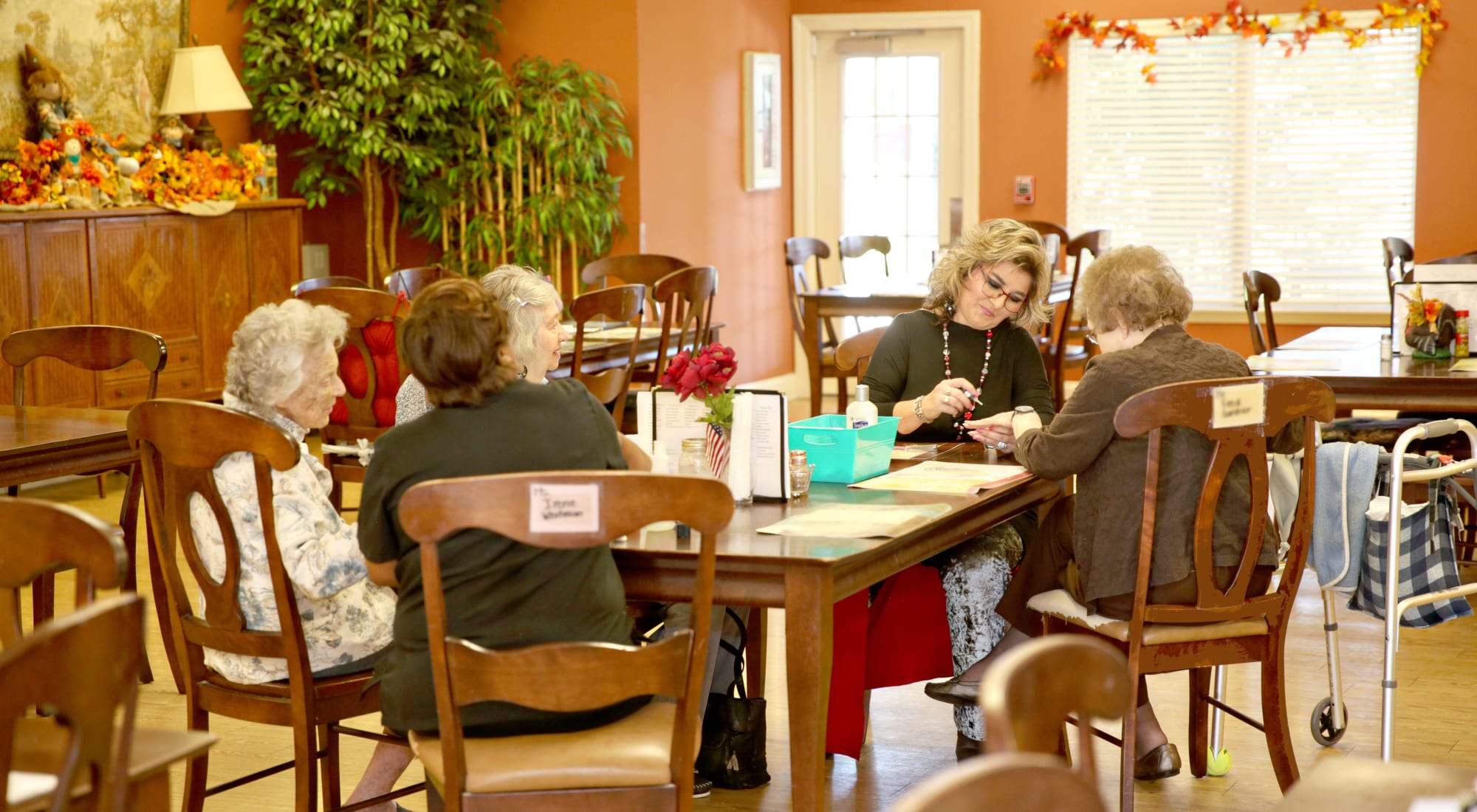 Residents and staff engaged in an activity in a common area