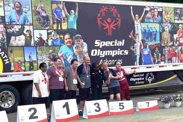 Group of participants with medals at a sports event