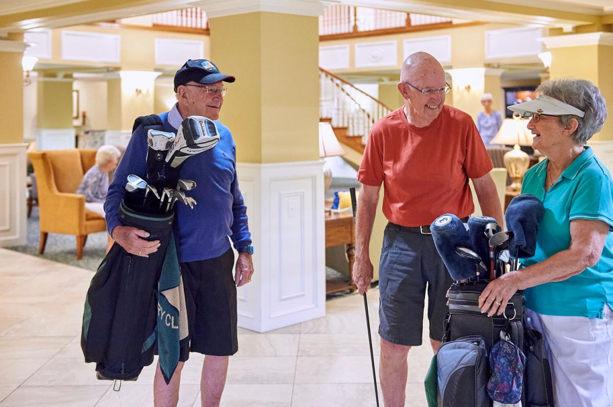 Residents engaged in a fun indoor golfing activity