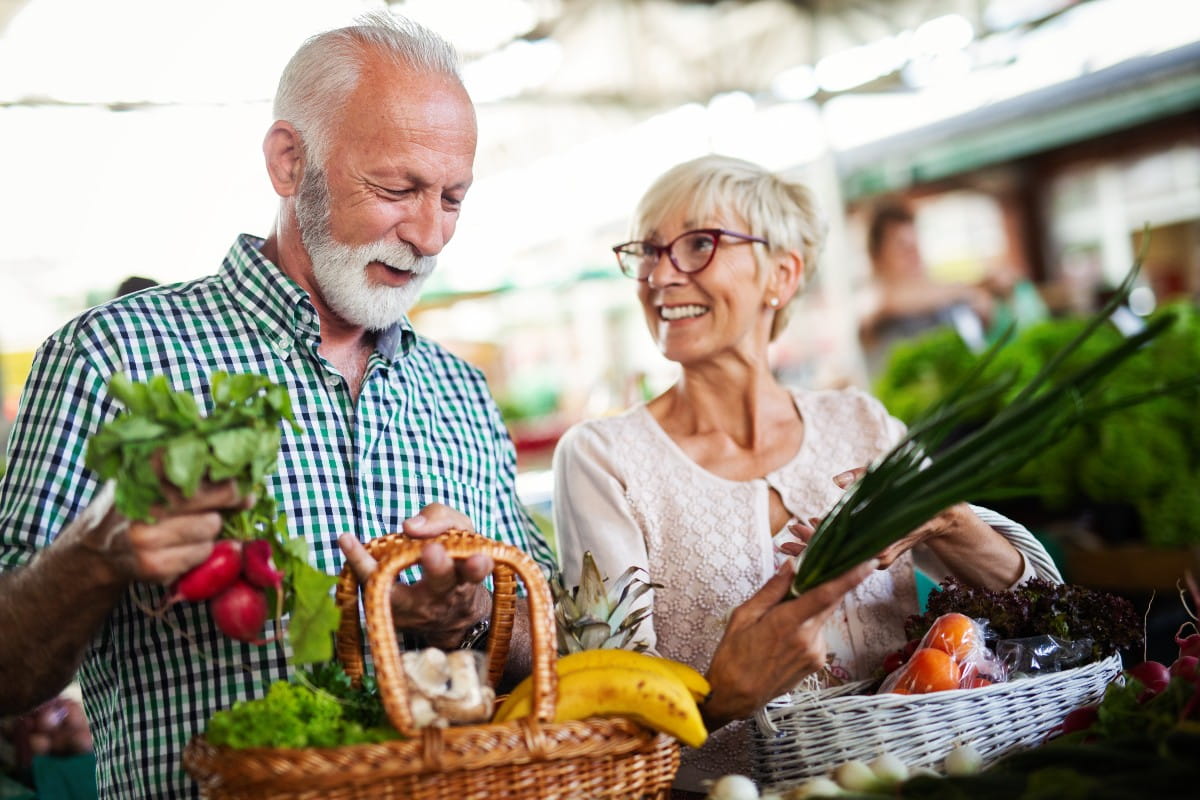 Seniors enjoying fresh produce at a market