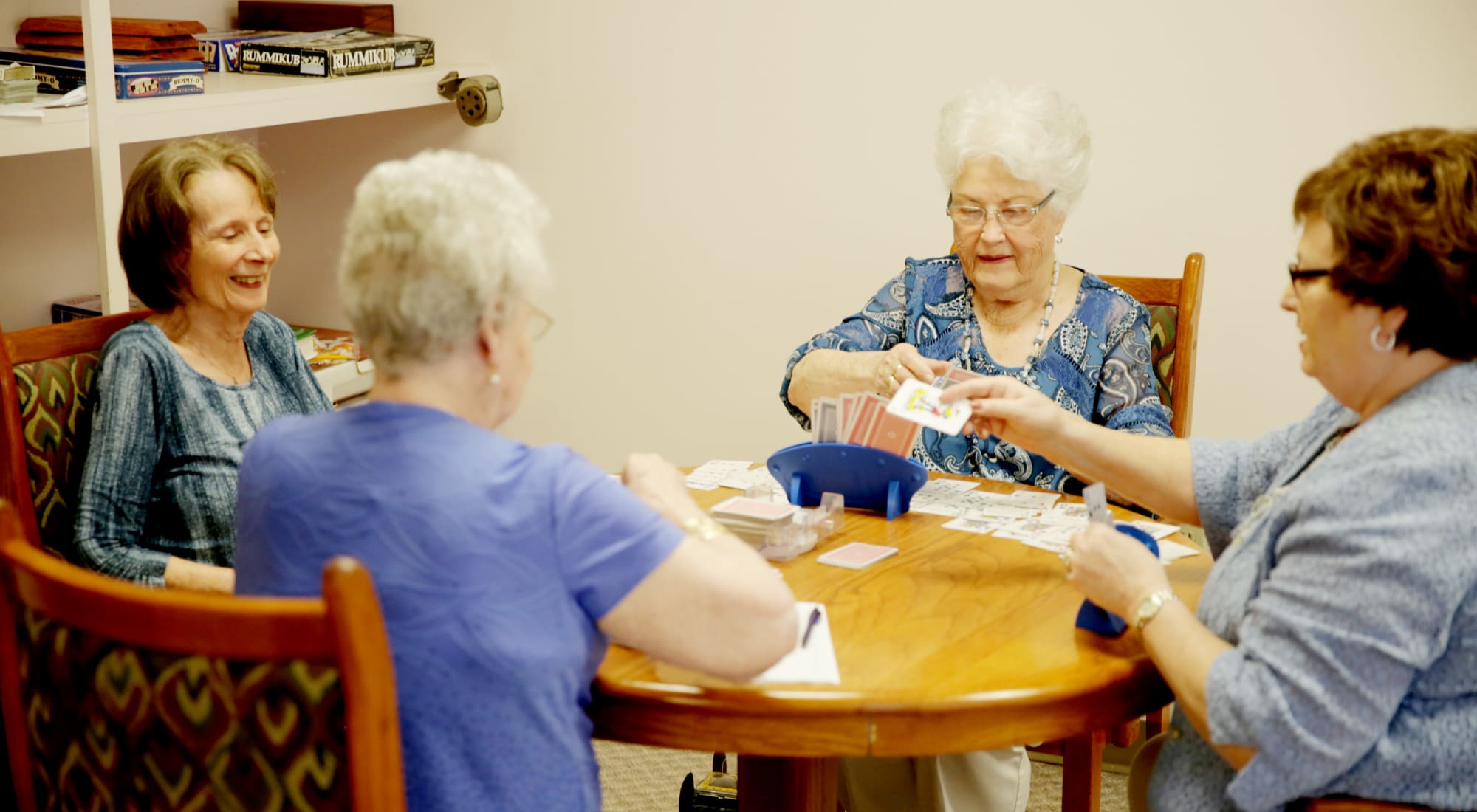 Residents playing cards in a common area