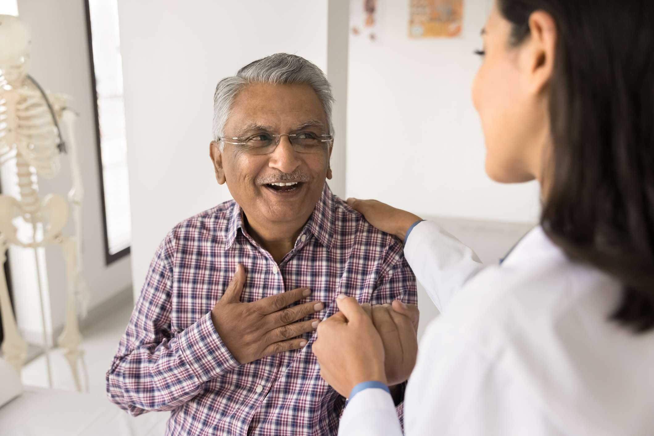 Senior resident enjoying a moment with staff member
