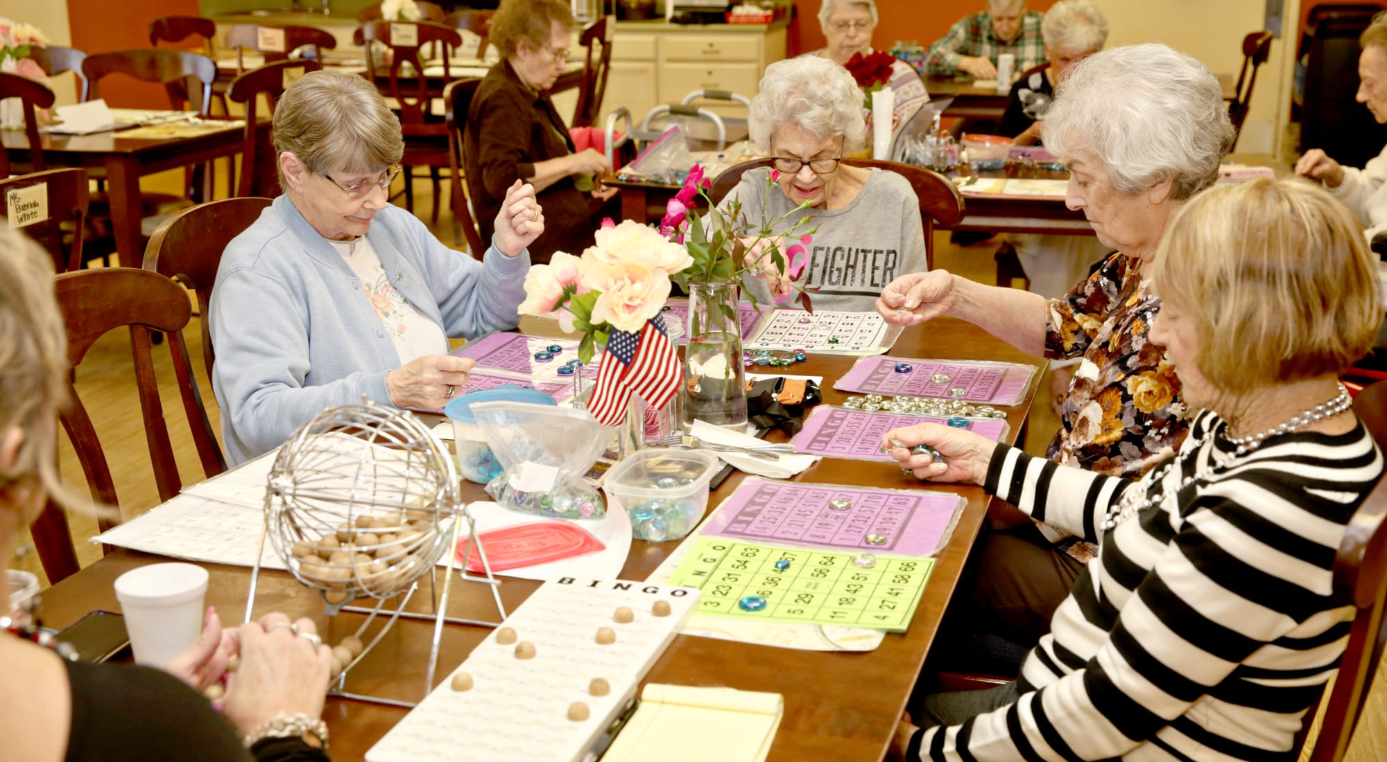 Residents engaged in a lively bingo game