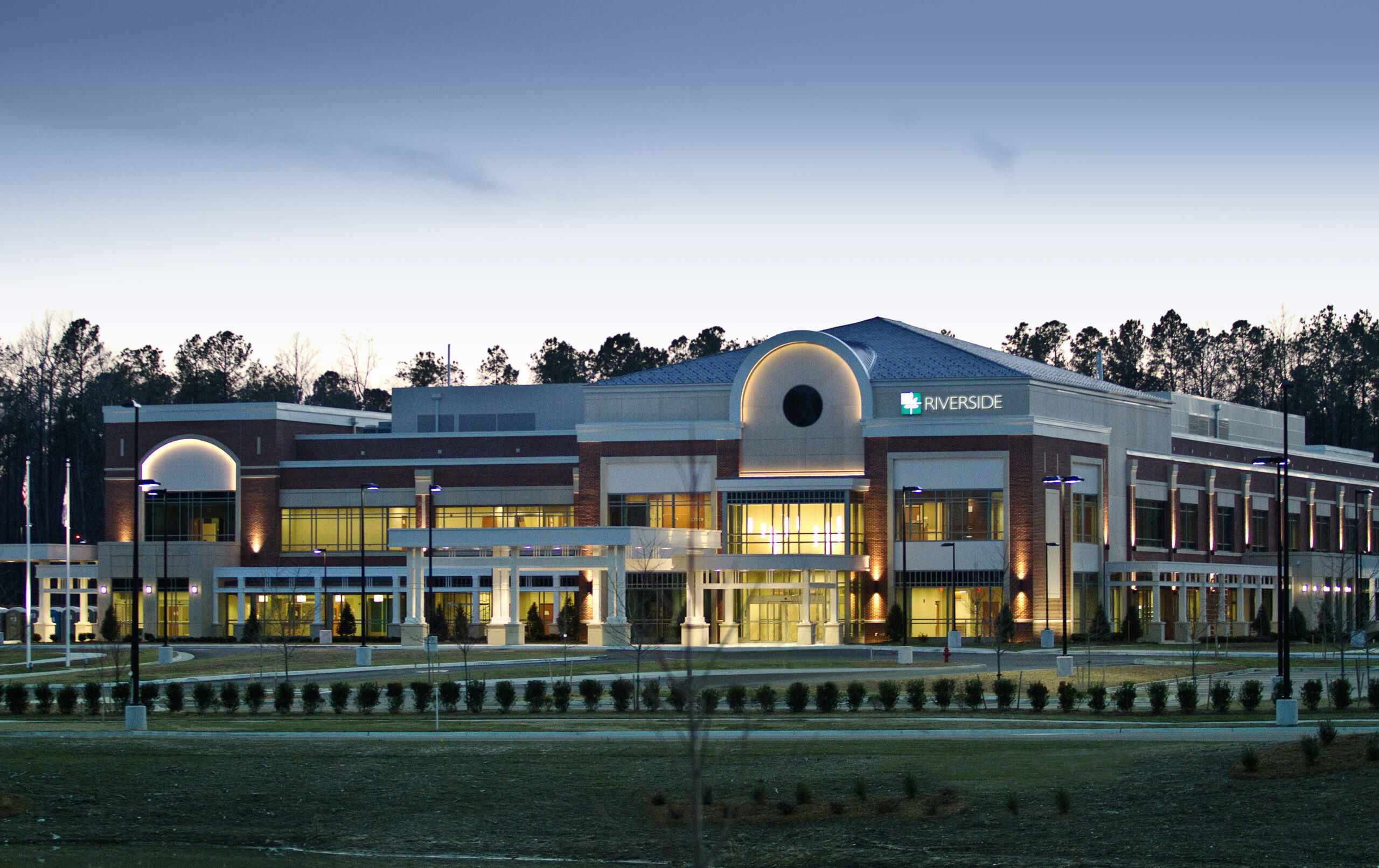 Exterior view of a senior living facility at dusk
