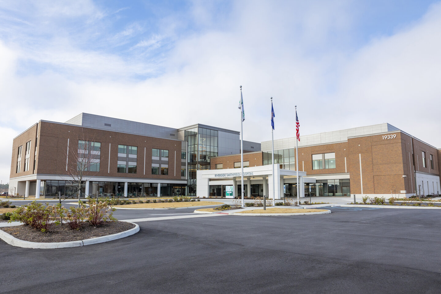Exterior view of Warwick Forest facility with flags