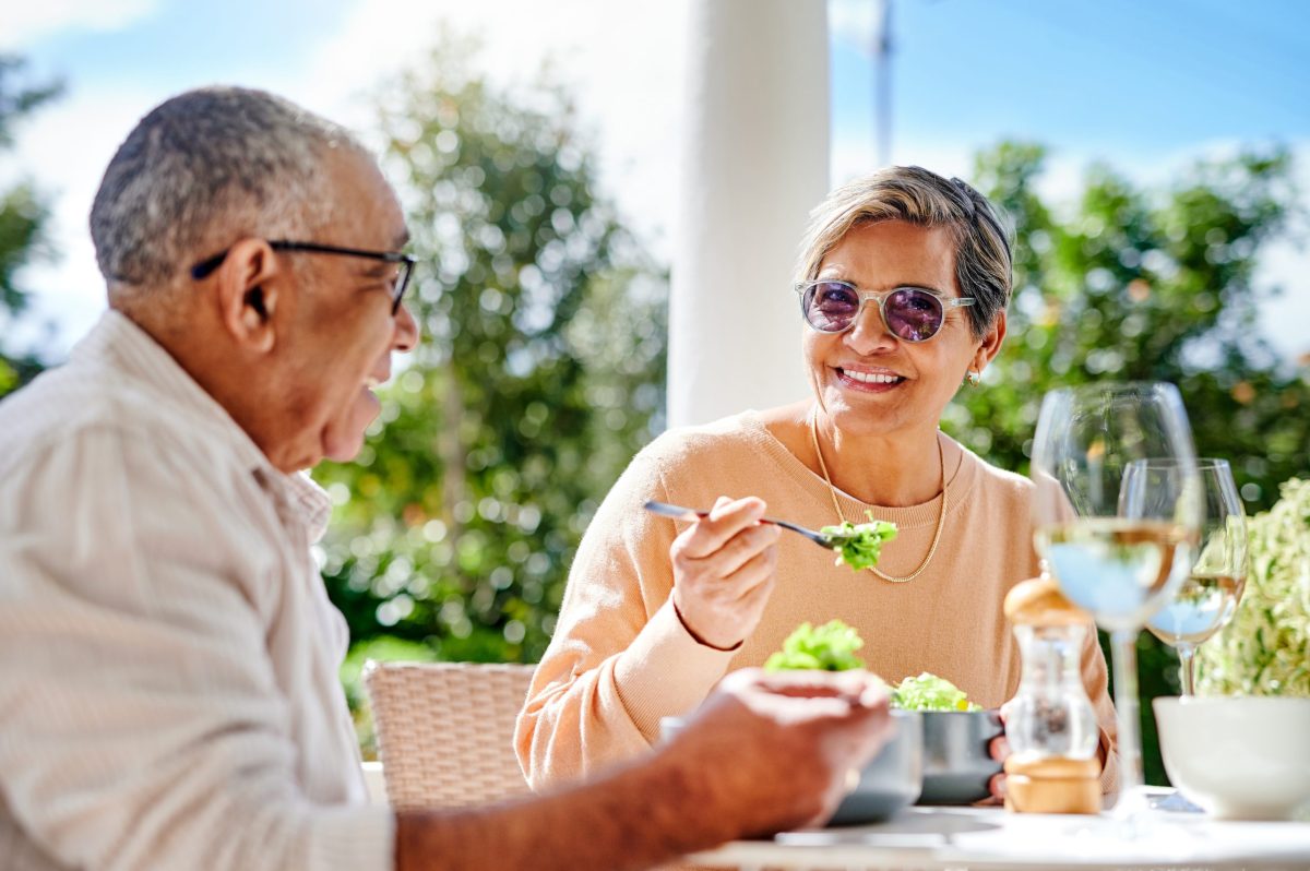 Two residents enjoying a meal outdoors