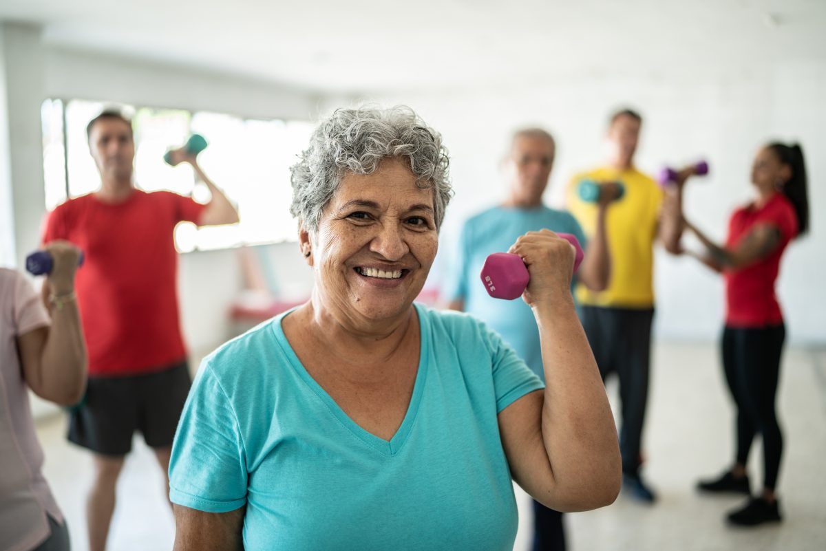 Residents participating in a fitness activity indoors