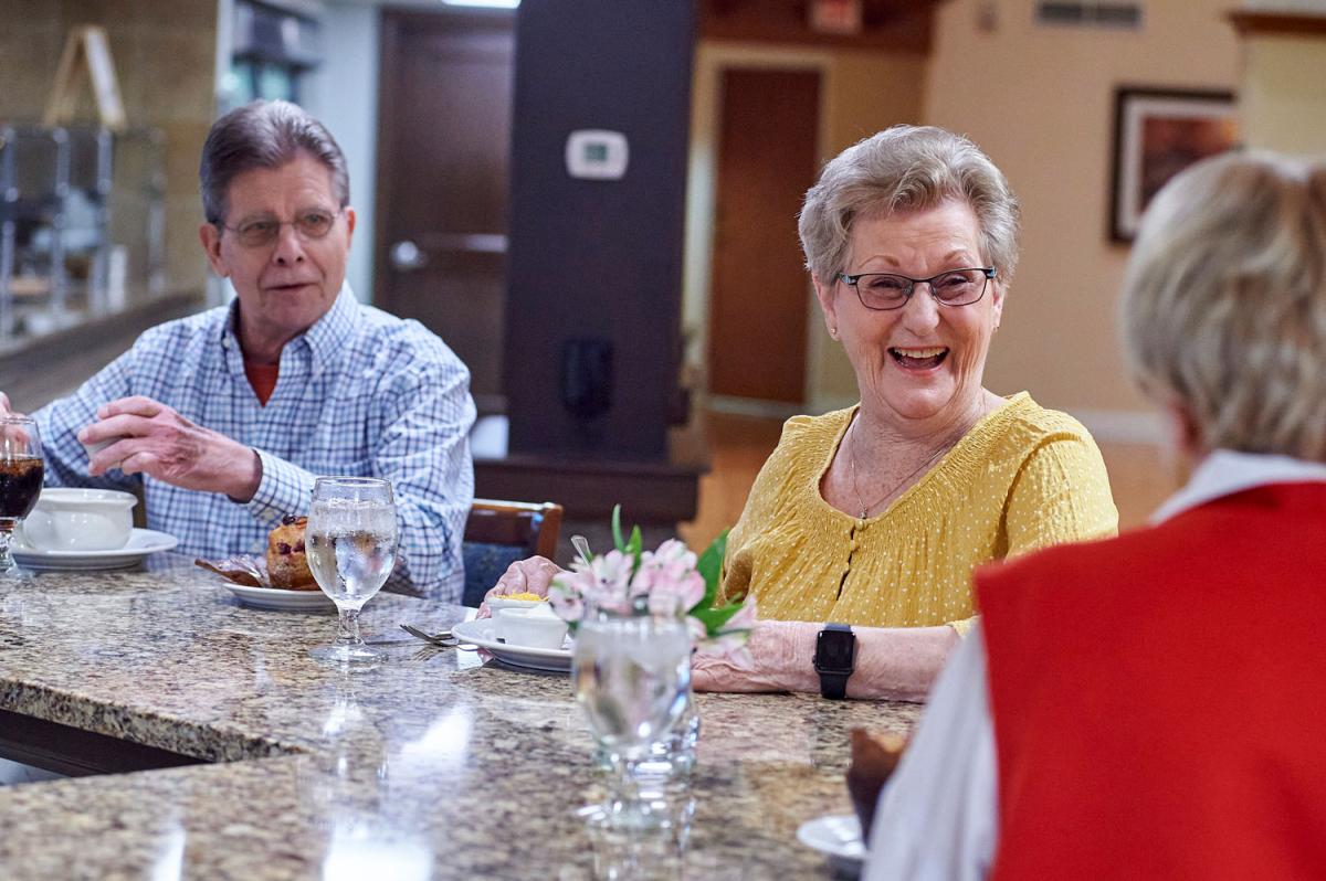 Residents enjoying a meal in a dining area