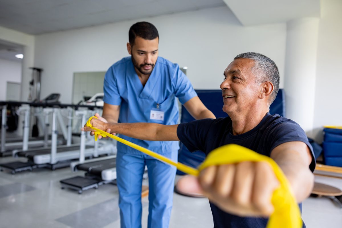 Resident engaging in physical therapy with staff member