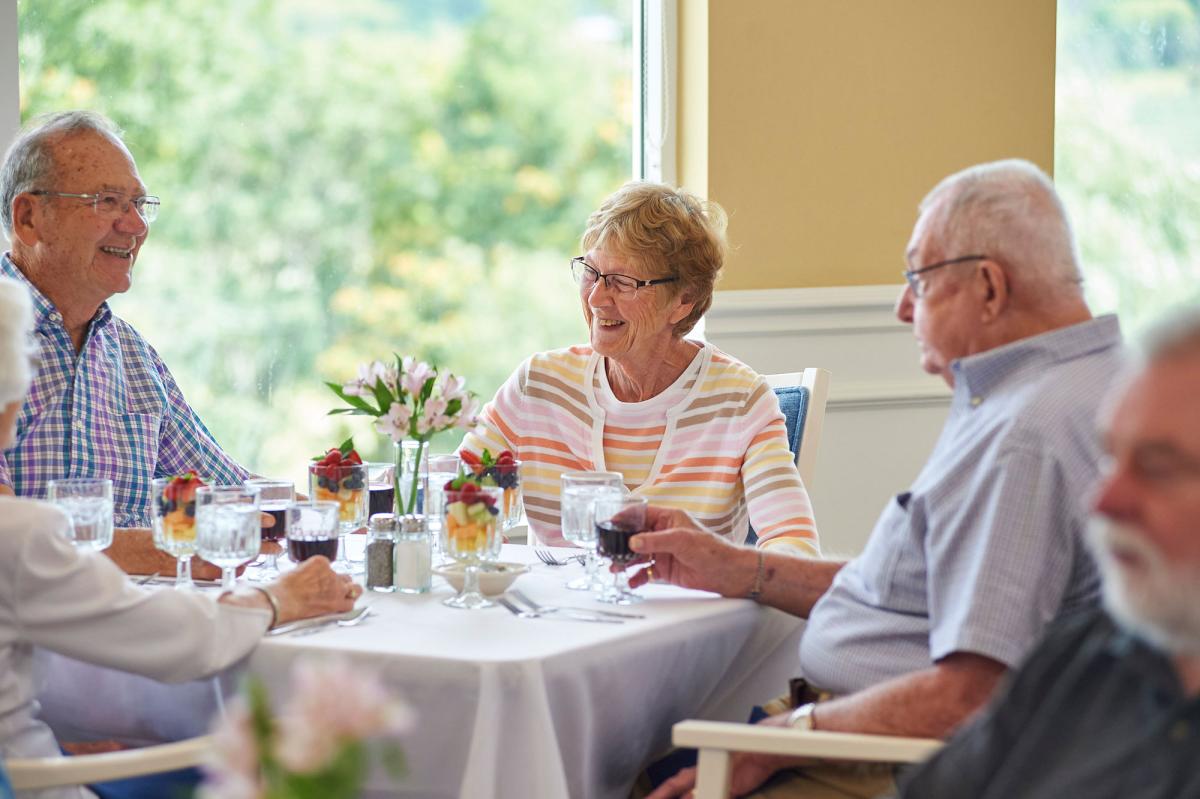 Residents enjoying a meal together in a dining area