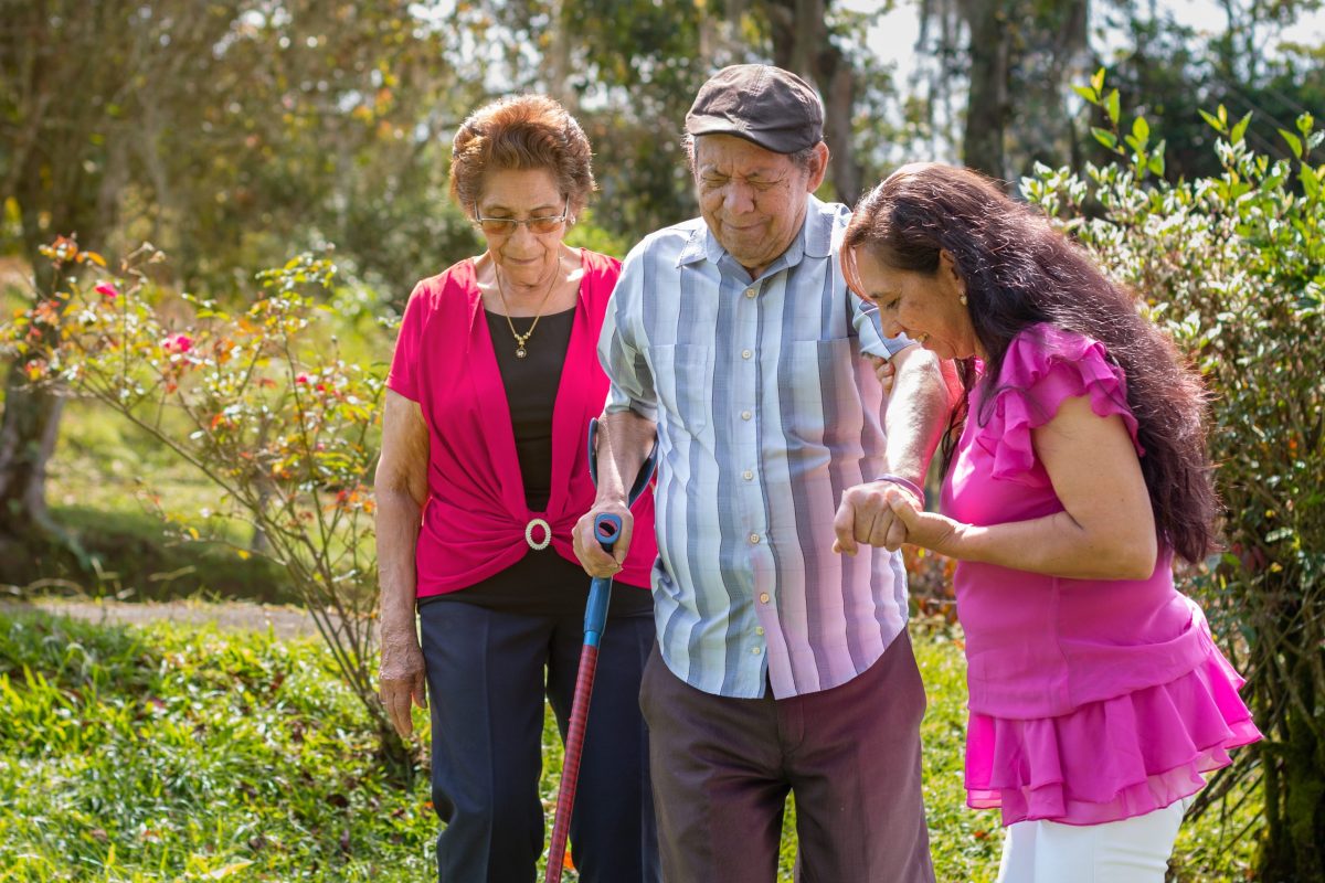 Residents enjoying a walk in a garden area