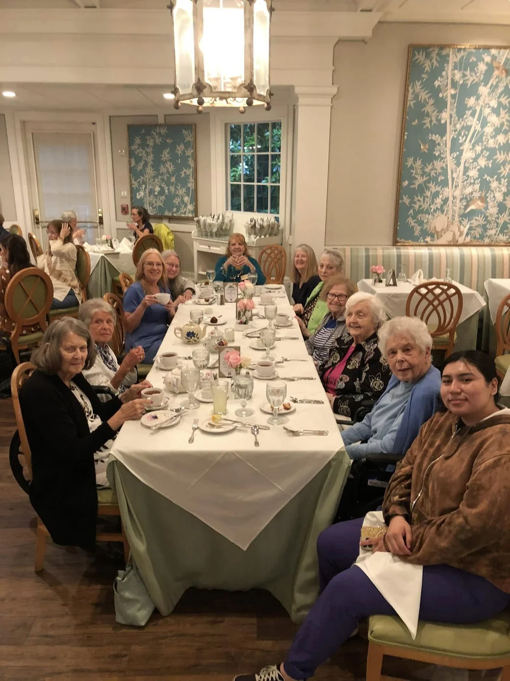 Residents enjoying a meal together in the dining room