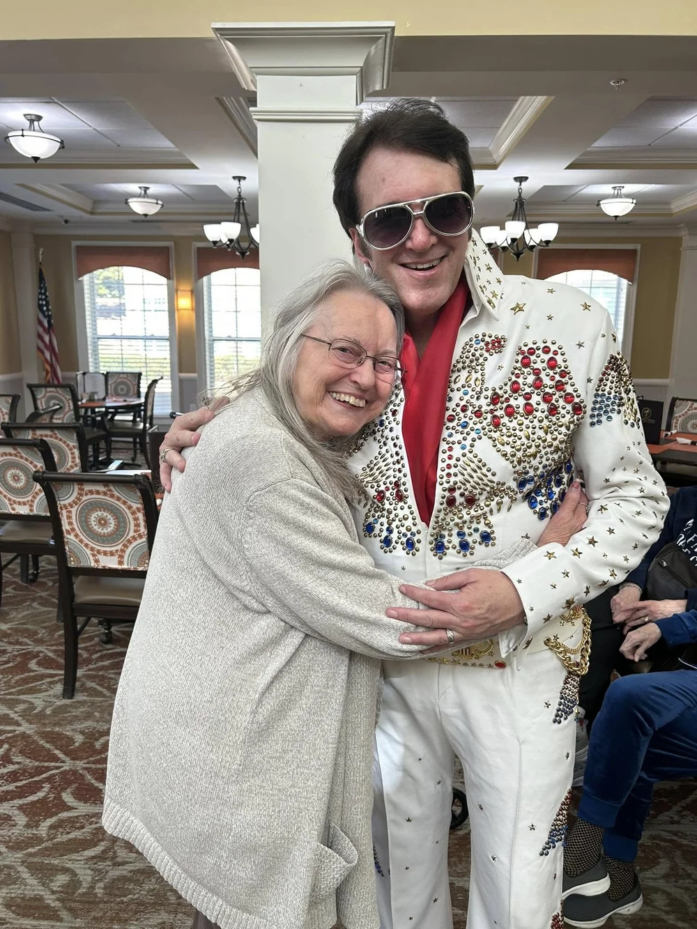 Residents enjoying a performance in a common area