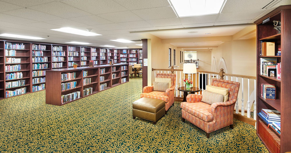 Cozy reading area with bookshelves and seating