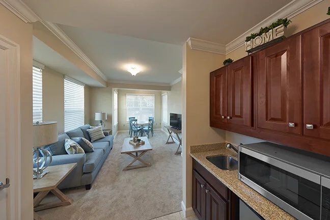 Interior view of a resident living space with a kitchenette