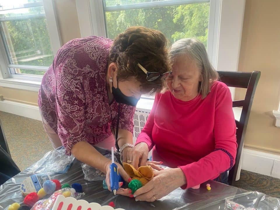 Residents engaging in a crafting activity together